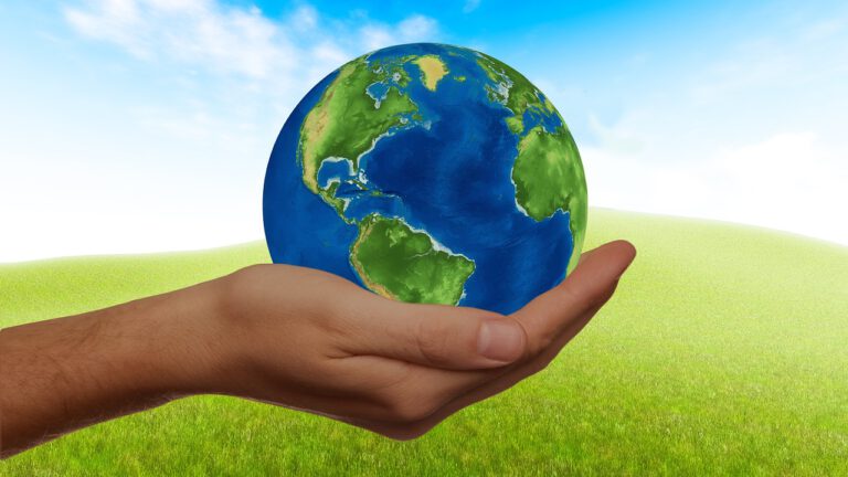 Hand holding a globe